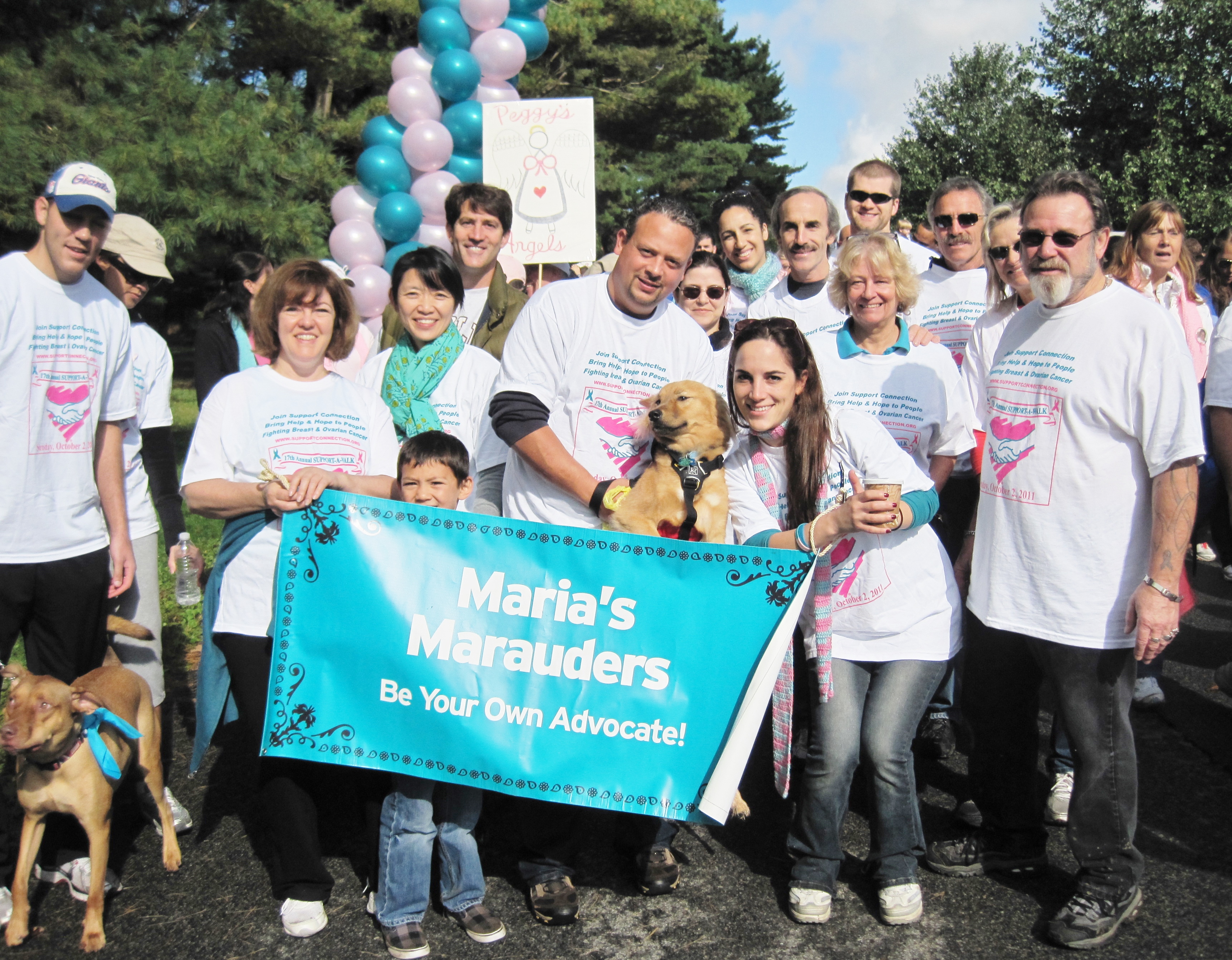 Melissa with team banner